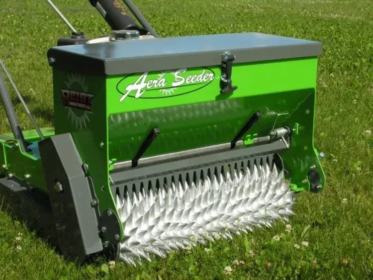 Close-up of the AeraSeeder seeding drum on a lawn