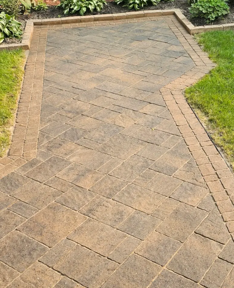 The same walkway after restoration and sealing — clean joints, rich warm colour