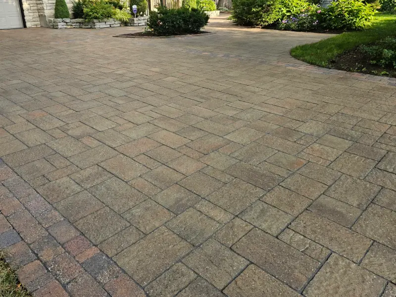 Warm multi-tone paver driveway with clean, uniform joints
