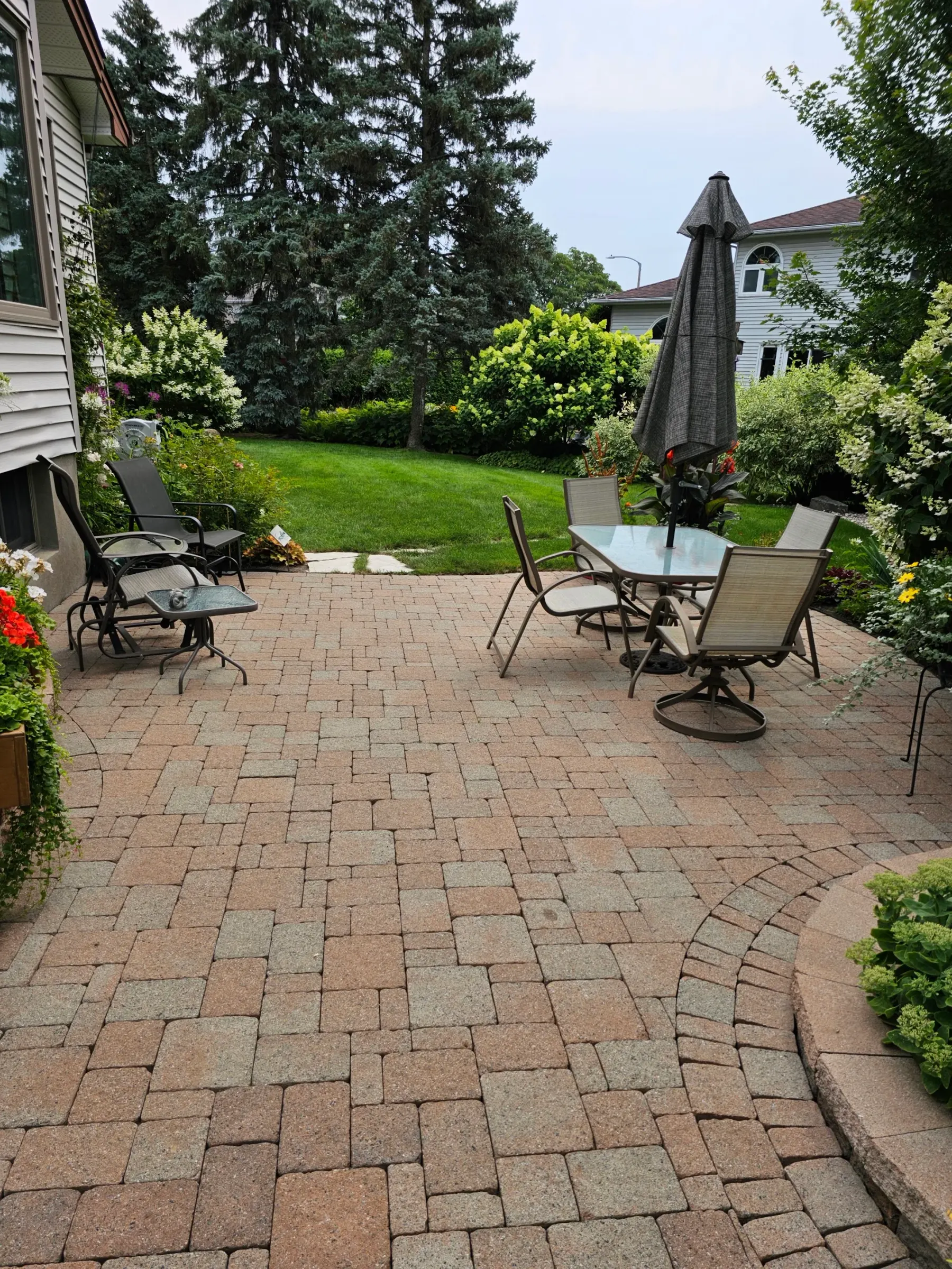 The same patio cleaned — joints cleared out, colour revived, ready for new sand